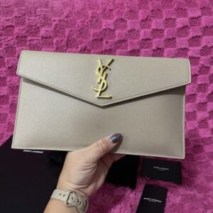 Saint Laurent UPTOWN POUCH IN GRAIN DE POUDRE LEATHER. Color: Dark Beige.